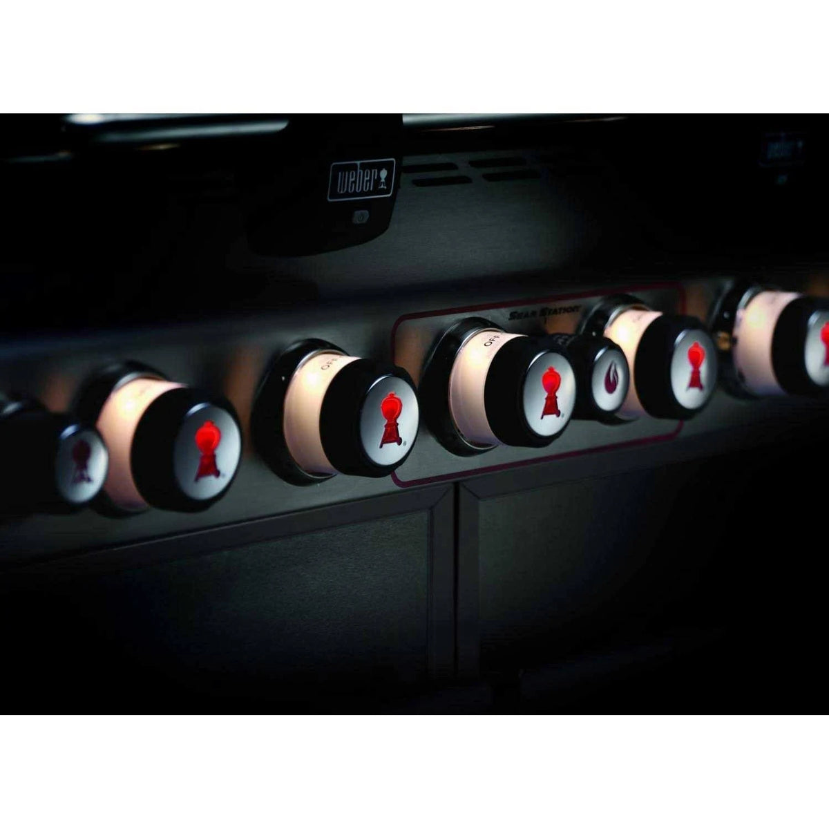 close up of the knobs of black Weber Summit E - 670 BBQ