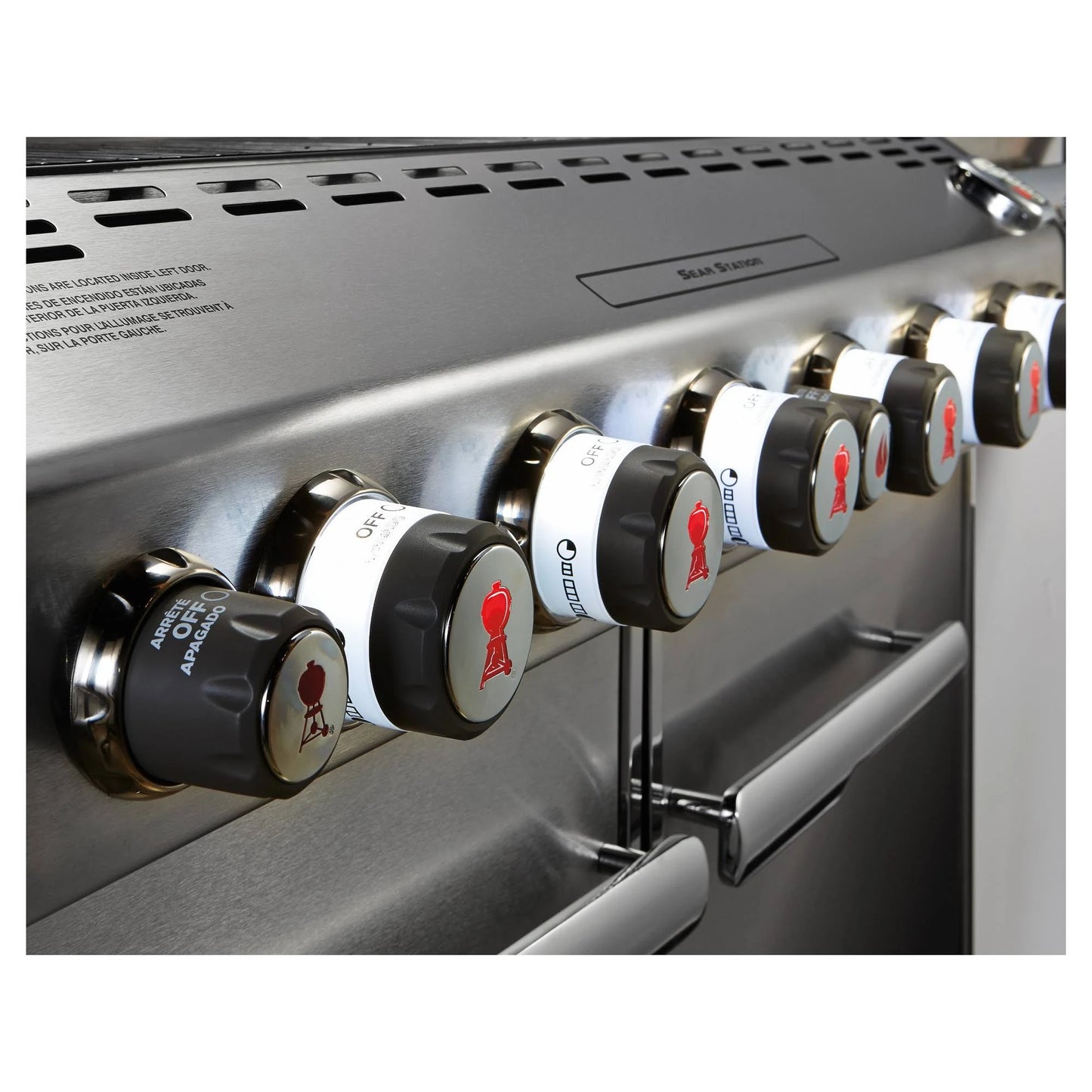 close up of the knobs of silver Weber Summit E - 670 BBQ