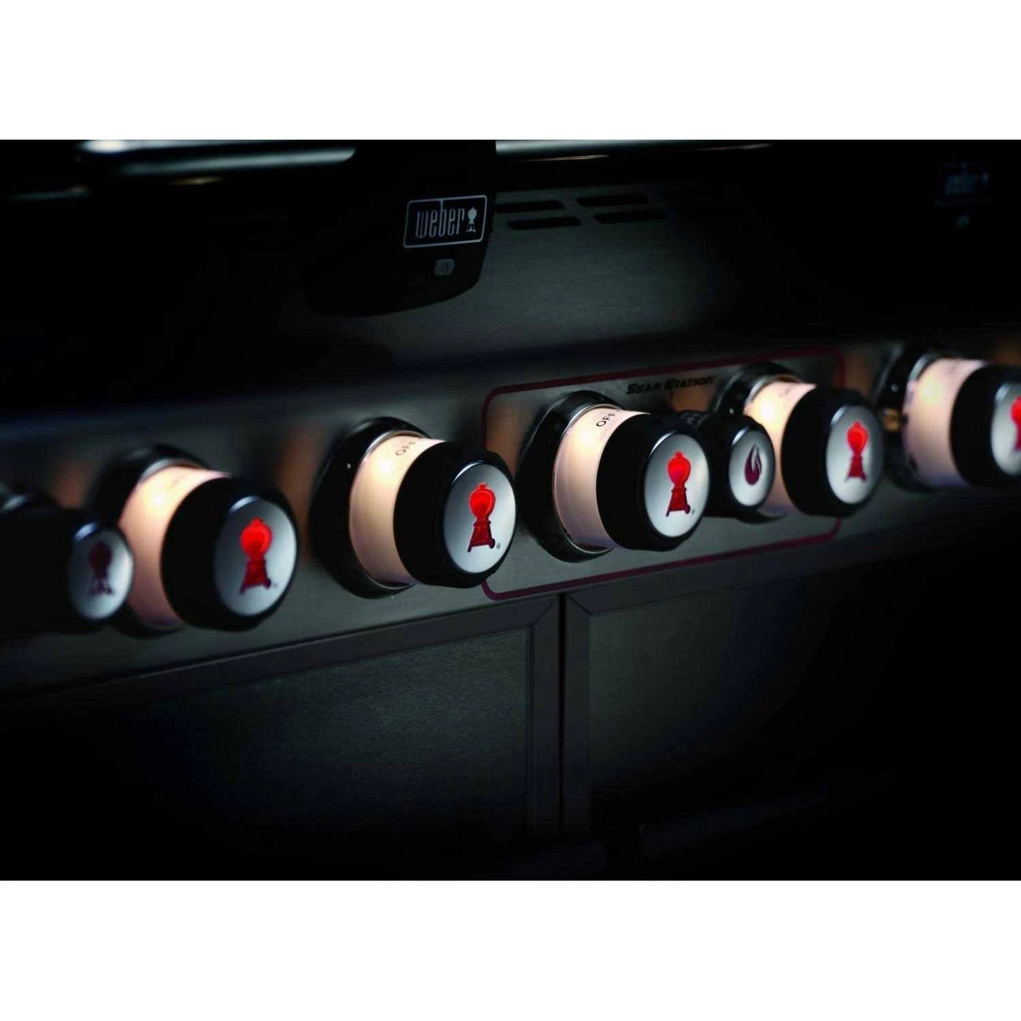 close up of the knobs of black Weber Summit E - 670 BBQ